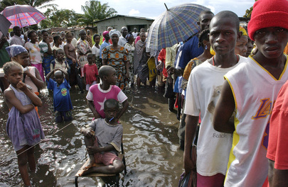 Standing in Knee Deep Water Waiting to Cast Their Vote