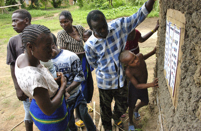 Villagers Read Sample Ballots