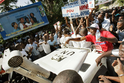 UN Mission Vehicle Blocked by Crowd in Haiti