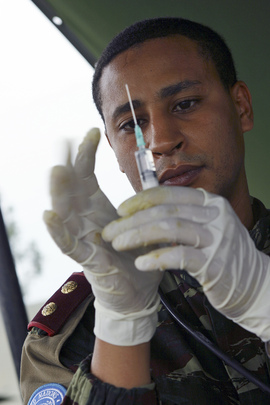 MONUC Medical Doctor Prepares to Administer Injection