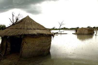 Mud Houses Surrounded by Floodwaters
