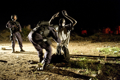 Emergency Response Unit Officer Searches Suspect