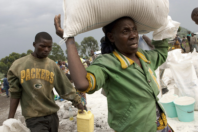 IDP Camp Residents Carry Food Rations Home