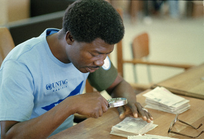 UNTAG Worker Verifies aTendered Ballot at Windhoek Election Centre